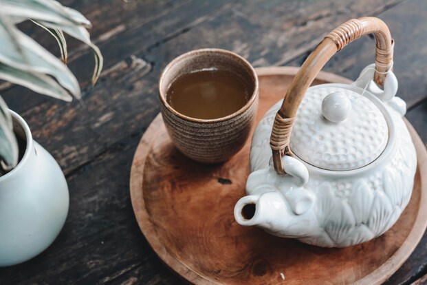 A cup of tea and a teapot